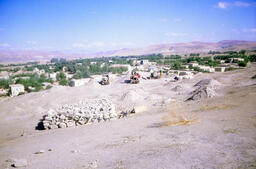 Excavation on Aşvan Kale, The Village and The Mountains on Background